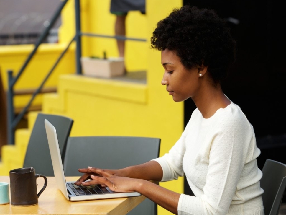 attractive-young-woman-using-laptop-outside-P9RLFGU@2x-1024x798-1.jpg